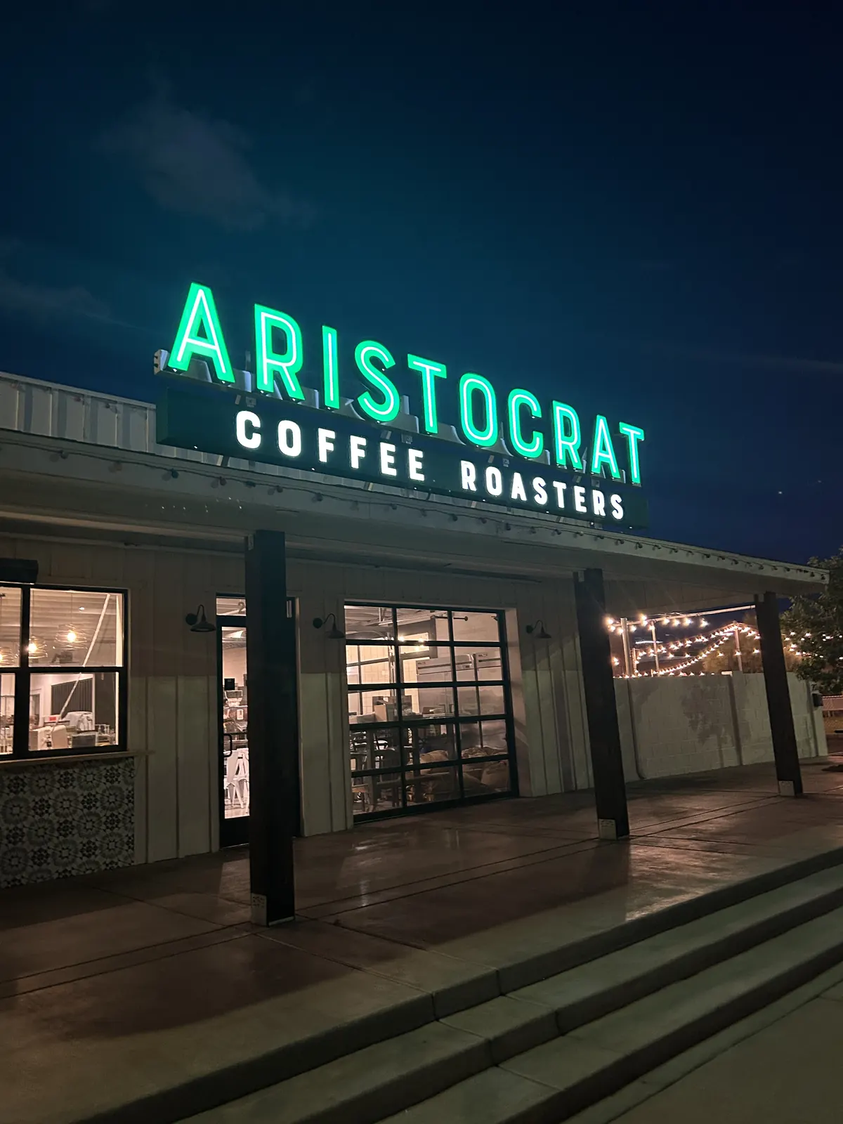 Inside Aristocrat Coffee's downtown Chandler cafe with seating and espresso bar
