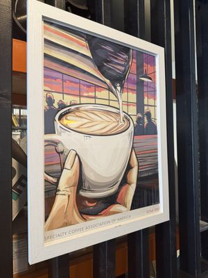 Wall art in the shop — vinyl, vibes, and music Paul curates daily.